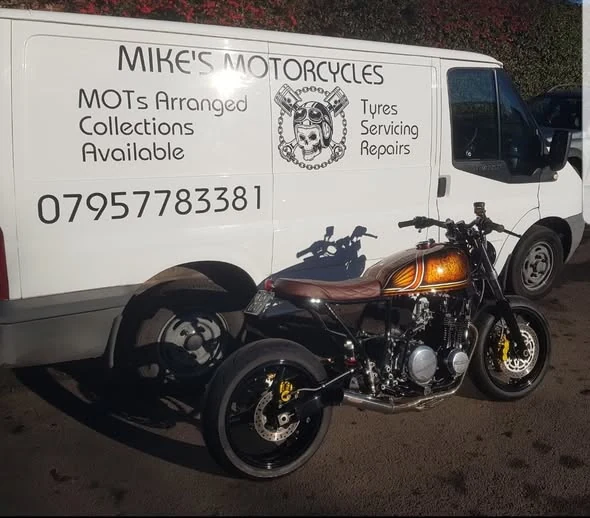 Custom motorcycle beside the Mike's Motorcycles van