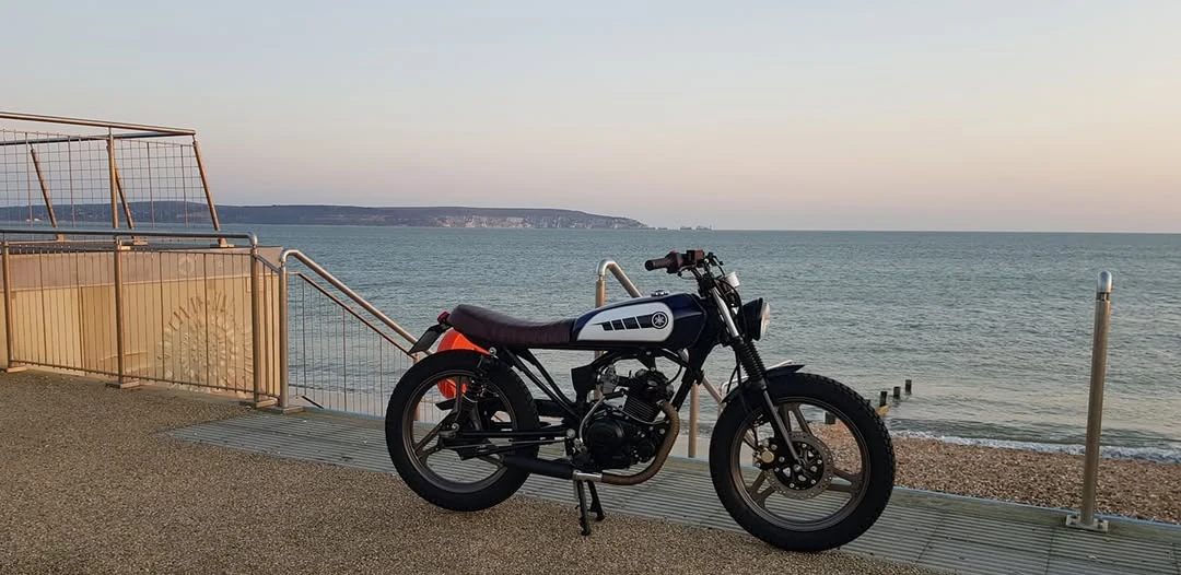 Completed custom motorcycle by the coast